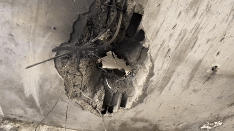 A GBU-39 bomb impact on the ground floor