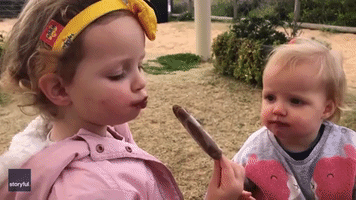 Toddlers Share Ice Cream 