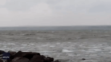 Waves of Ice Hit Shoreline on Frozen Lake Superior