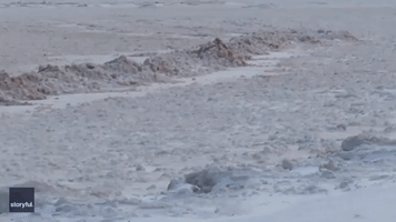 Small Ice Balls Pile Up on Frozen Lake Superior