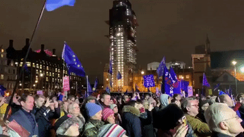 Crowd Cheers in London's Parliament Square After May's Brexit Vote Defeat