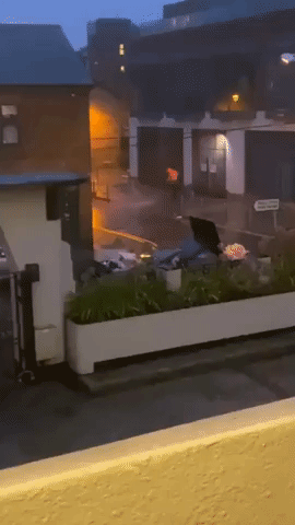 Local Baffled as Man Hoses Down Path During Storm Deluge in Dublin