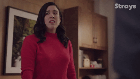 TV gif. Shannon Ross as Nicole Powers on Strays sighs in frustration as she fidgets her arms.