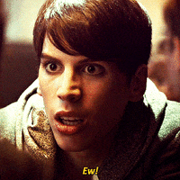 TV gif. Jordan Gavaris as Felix Dawkins on Orphan Black leans towards someone and cringes in disgust as he says, “Ew!”