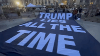 Anti-Trump Demonstrators Unfurl Banner Near Manhattan Court