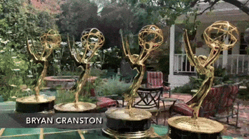 Bryan Cranston Does Yoga With His Emmys