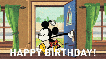 Disney gif. Mickey Mouse enters a festively decorated room full of his friends who are celebrating wildly. Text, “Happy Birthday!”