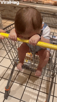 Baby Keeps His Head Down in Supermarket 