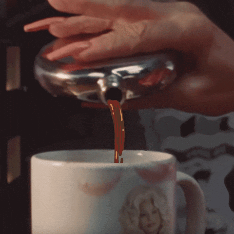 Digital art gif. Hand with long fingernails pouring the contents of a silver flask into a coffee mug with Dolly Parton on it, pouring infinitely. 