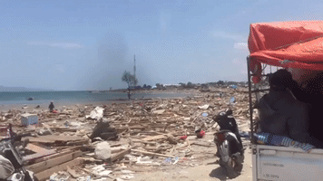 Residents Survey Destruction Left by Tsunami in Palu