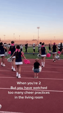 Adorable Two-Year-Old Boy Shows Off Cheerleading Skills With Sister's Squad