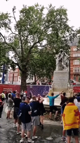 Scottish Soccer Fans Form Conga Line in Leicester Square Ahead of Euros Match in England