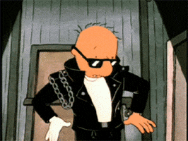 Cartoon gif. Doug Funnie from 90s animation Doug is uncharacteristically dressed in a black leather jacket with chains, tight black jeans, black shades, and a singular white glove. He looks down at his outfit and shrugs, as if he has no explanation.