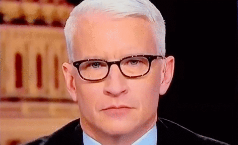 Celebrity gif. Anderson Cooper rolls his eyes dramatically, then blinks in annoyance.