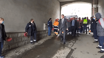 Striking Russian Dock Workers Throw Hard Hats at Management Delegation