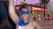ComedianHollyLogan mask fighting superhero costume GIF