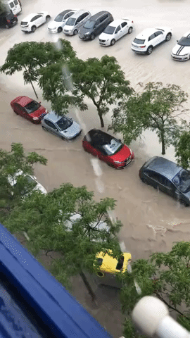 Floodwaters Rise Around Parked Cars in Alicante, Spain