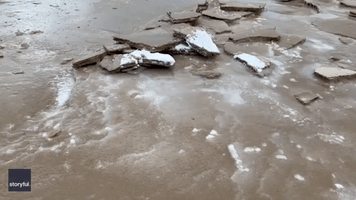 Freezing Conditions Create Slabs of Sand on Michigan Beach