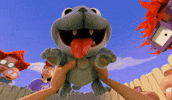 Cartoon gif. Two hands from the first person perspective hold up a happy dog with a slobbery pink tongue hanging out. Chuckie, Tommy, Didi, and Betty from Rugrats lean into look at us with happy or curious expressions.