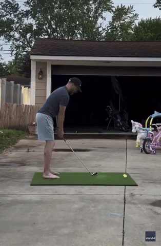 Ow! Golfer Accidentally Ricochets Ball Off Garage Directly Into His Knee