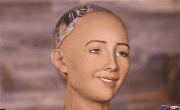 GIF of a robot looking at a screen with a confused expression