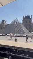 Tourists Wade in Louvre Fountain Amid Paris Heat Wave