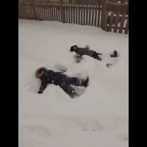 Children Play in Snow After Washington State Experiences Record-Low Temperatures