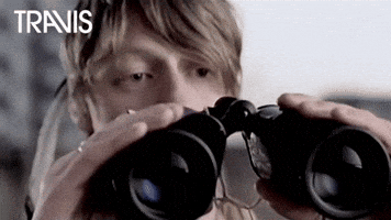 Looking Peeping Tom GIF by Travis