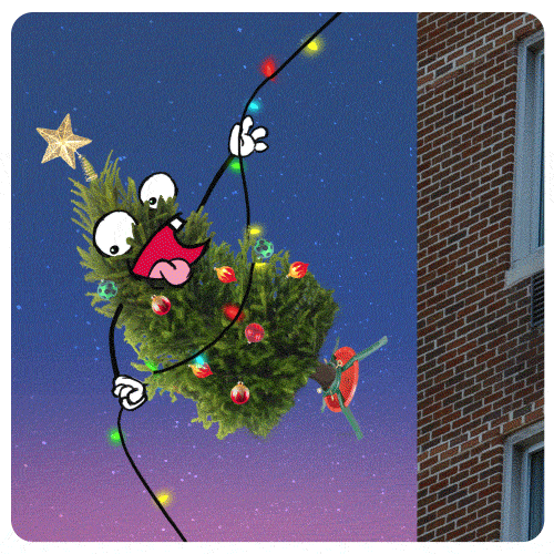 Digital art gif. Decorated Christmas tree with a goofy face descends a belay, bouncing off a brick building with its tree stand.