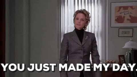 Movie gif. Amy Sedaris as Deb in Elf. She puts a hand up to her chest and smiles, touched at something someone has done. She says, "You just made my day!" and approaches us. 
