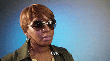 Reality TV gif. Nene Leakes on Real Housewives of Atlanta has large sunglasses that take up half her face. She makes a peace sign with her hands, and says, “Bye.” with an unamused expression.