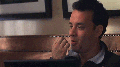 A GIF from the movie 'You've Got Mail' - Tom Hanks blows on his fingers, rubs them together and hits the 'send' button on his keyboard.