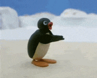 Stop motion gif. Claymation penguin Pingu stands in a snowy landscape and claps his flipper-like wings in applause. 