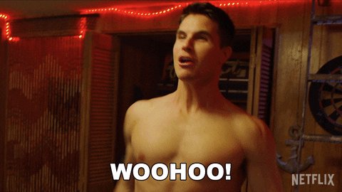 Movie gif. Robbie Amell as Max in The Babysitter: Killer Queen is shirtless and showcasing his muscles, appearing energized and exclaiming, "Woohoo!" 