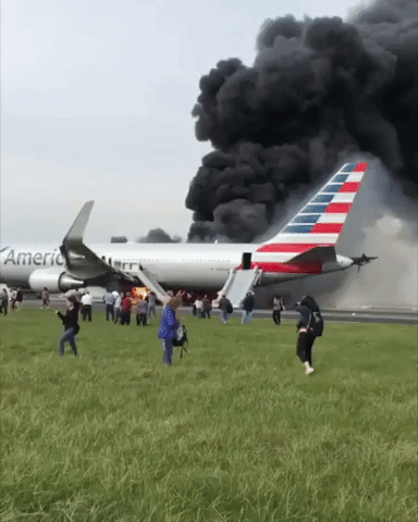 Passengers Evacuate Burning Plane at Chicago Airport