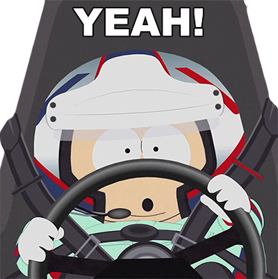 South Park gif. Closeup of Eric wearing a helmet and driving suit as he steers a car and squeezes his eyes shut while shouting. Text, "Yeah!"