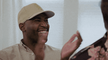 TV gif. Karamo Brown in Queer Eye claps three times while smiling.