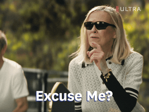 Sponsored gif. Actress Catherine O’Hara holds up her hand in question and looks confused. Text reads, “Excuse me?”