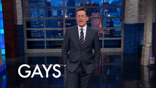 Late Show gif. Stephen Colbert has his hands in his pocket and triumphantly announces on stage, "Gays in space!"