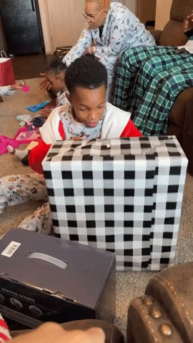 Little Boy's Heartwarming Reaction to Christmas Pr
