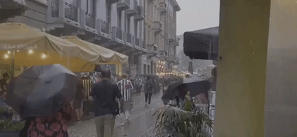 Soccer Fans Gather in Rainy Milan Streets Ahead of Champions League Matchup