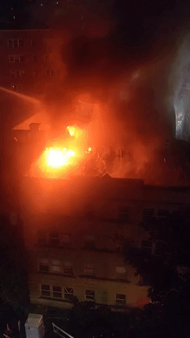 Firefighters Rescue Man From Building Fire in Seattle