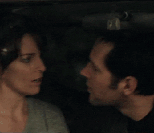 Movie gif. Paul Rudd as John cradles his hand around Tina Fey as Portia's neck in Admission as they lean in and kiss passionately.