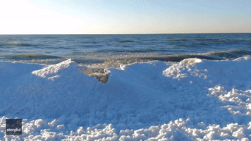 Drone Video Captures Hypnotic Icy Waves Crashing into Lake Michigan Shoreline