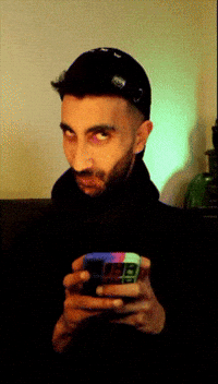 Suspicious Smirk GIF