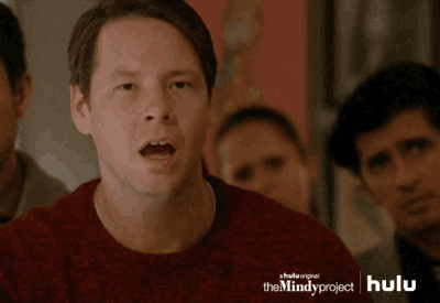 TV gif. Ike Barinholtz as Morgan Tookers from The Mindy Project stands in a crowd looking surprised and disappointed, and covers his eyes with his hand.