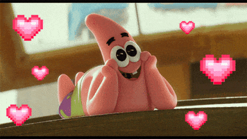 SpongeBob gif. Patrick lies on his stomach, pink legs kicking back and forth behind him in the air. His cheeks rest on his hands as he gazes with wide, longing eyes. Pixelated pink hearts beat around him. 
