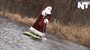 santa paddleboard GIF by NowThis 