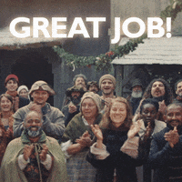 Video gif. Group of people wearing colonial clothing smile and look at us while clapping. Text, "Good Job."