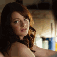 Celebrity gif. Emma Stone smiles and looks at us while throwing us a big thumbs up.